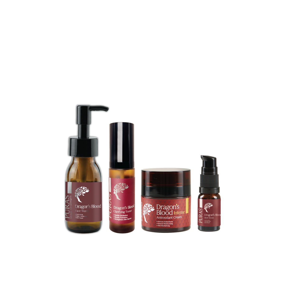 Four amber glass cosmetic bottles and jars with black caps arranged on a plain white background. The labels read Dragon's Blood, including Hair Oil, Hair Growth Serum, Intensive Lip Balm, and a smaller serum bottle.