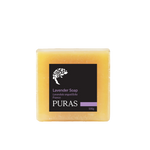 A rectangular bar of PURAS Lavender Soap in a pale yellowish-orange color, featuring a black label with white text and a small purple accent stripe, set against a plain white background.