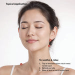 Woman with closed eyes, showing points on her neck and ear for relaxation.