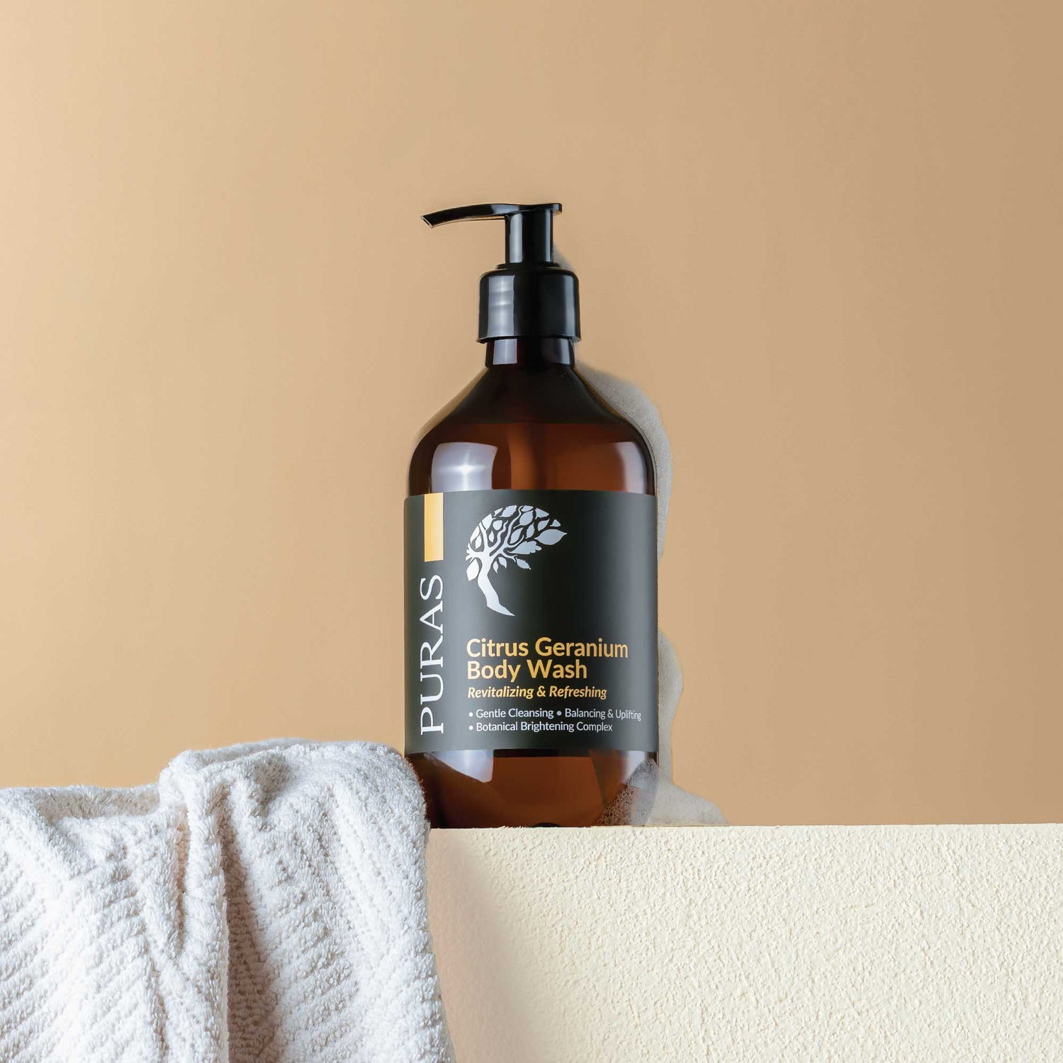 bottle of Citrus Geranium Body Wash with pump on a beige background