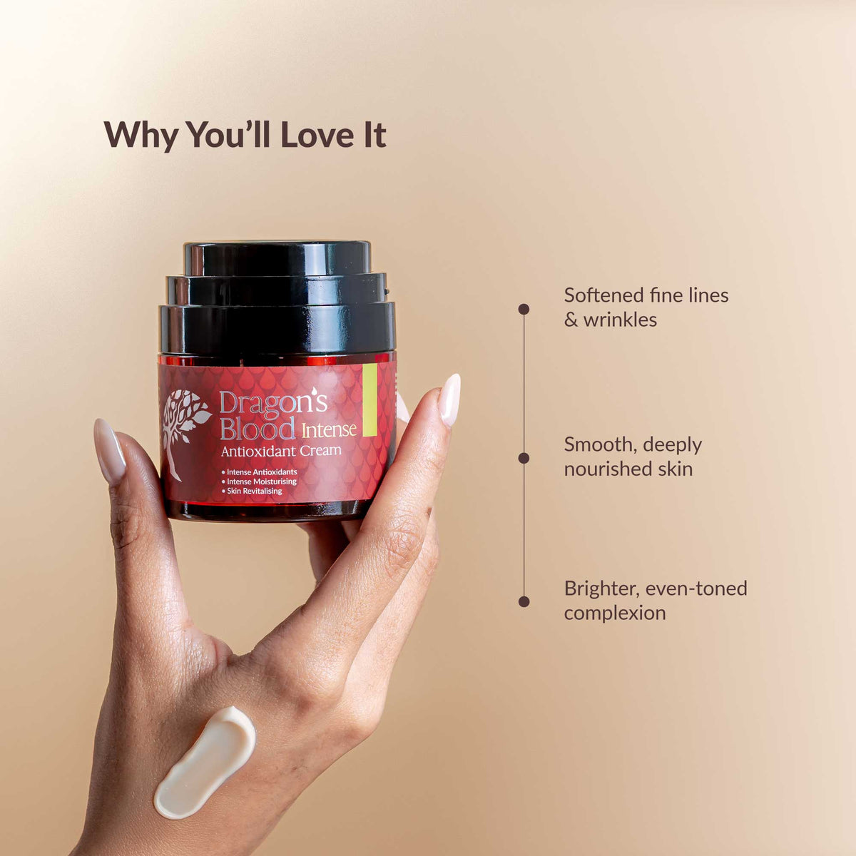 Hand holding a jar of 'Dragon's Blood Intense' antioxidant cream with text on a beige background