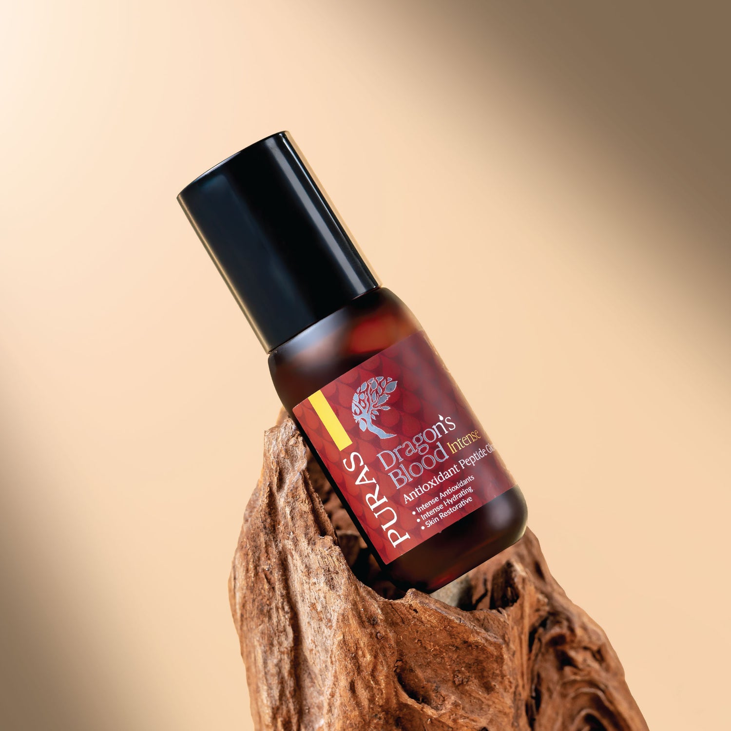 Puras Dragon's Blood Intense Peptide Glow Serum bottle on a wooden block with a beige background