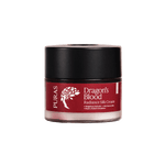 Puras Dragon's Blood Radiance Silk Cream in a clear jar showing the deep red cream inside, with a black lid and a dark red label featuring a white tree logo.