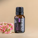 Puras Ease The Stom essential oil blend bottle with pink flowers on a beige background