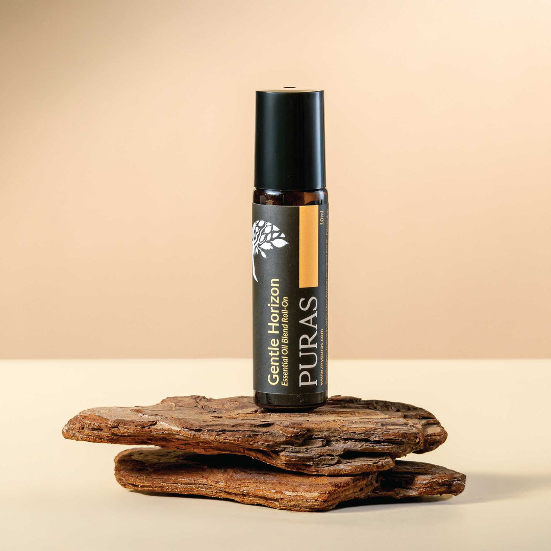 Puras "Gentle Horizon" essential oil roll-on bottle on a wooden surface with a beige background