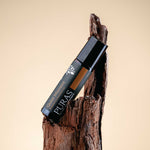 Puras "Quiet Moment" roll-on on a wooden background