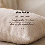 Beige pillow with five-star rating and customer review on a neutral background