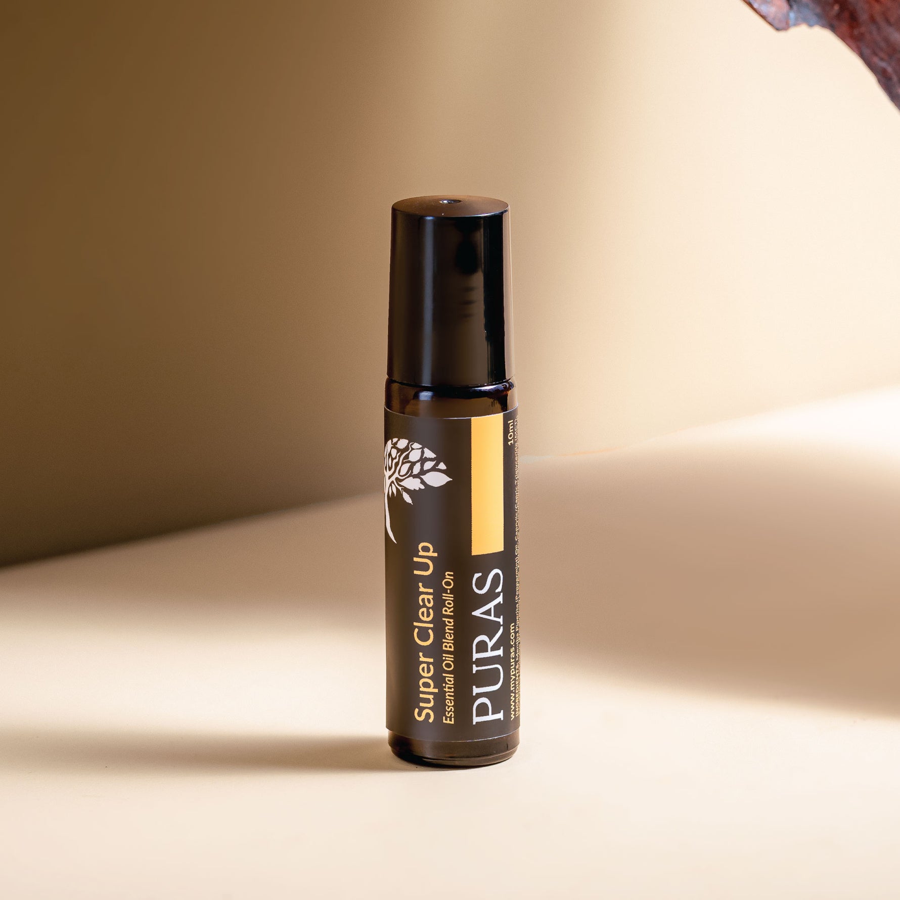 Puras Super Clear Up bottle on a beige background